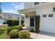Charming front exterior with well-maintained landscaping, cozy porch, and a one-car garage at 948 Consortium Dr, Raleigh, NC 27603