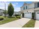 Charming townhome with an attached one car garage and a manicured front lawn at 948 Consortium Dr, Raleigh, NC 27603