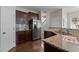 Kitchen showcasing granite countertops, stainless steel appliances, and dark wood cabinets at 948 Consortium Dr, Raleigh, NC 27603