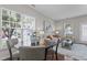 Open dining and living area filled with natural light, featuring modern decor at 948 Consortium Dr, Raleigh, NC 27603