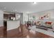 Open concept living space with hardwood floors, stainless steel appliances, neutral colors, and lots of light at 948 Consortium Dr, Raleigh, NC 27603
