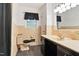 Well-maintained bathroom features black accents, a classic tile design, and vanity at 1015 S 1St St, Smithfield, NC 27577