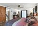 Bright bedroom with sliding barn door, dresser, and comfortable seating at 1015 S 1St St, Smithfield, NC 27577
