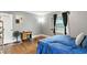 Cozy bedroom features neutral walls, wood flooring, and a vintage-style dresser at 1015 S 1St St, Smithfield, NC 27577