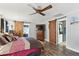 Bright bedroom with barn doors leading to the Primary bath and closet at 1015 S 1St St, Smithfield, NC 27577