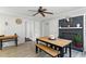 Inviting dining area with wooden table and bench, fireplace and light grey walls at 1015 S 1St St, Smithfield, NC 27577