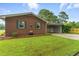 Charming brick home with well-manicured lawn and inviting curb appeal, set in a peaceful neighborhood at 1015 S 1St St, Smithfield, NC 27577