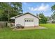 Detached garage with ample space and a well-maintained exterior, complementing the home's aesthetics at 1015 S 1St St, Smithfield, NC 27577