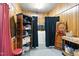 Functional laundry room with washer, dryer, and shelving for organized storage solutions at 1015 S 1St St, Smithfield, NC 27577