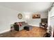 A well-lit living room showcases hardwood floors, a gray sofa, and neutral walls at 1015 S 1St St, Smithfield, NC 27577
