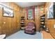 Cozy living room featuring wood paneling, comfortable seating, and a relaxing atmosphere at 1015 S 1St St, Smithfield, NC 27577
