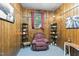 Comfortable living room with wood paneling, natural light, and cozy decor for a relaxing ambiance at 1015 S 1St St, Smithfield, NC 27577