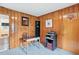 Functional office space featuring wood paneling and a desk for a cozy workspace at 1015 S 1St St, Smithfield, NC 27577