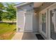 Back door with glass doors and light fixture on back patio at 102 Harvest Oaks Lane # 38, Durham, NC 27703