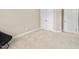 Carpeted bedroom with a built in closet and a black chair at 102 Harvest Oaks Lane # 38, Durham, NC 27703