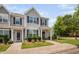 Two-story townhome with a well-maintained lawn and neutral color scheme at 102 Harvest Oaks Lane # 38, Durham, NC 27703