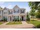Charming townhome with manicured lawn and traditional architectural details at 102 Harvest Oaks Lane # 38, Durham, NC 27703