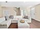 Spacious living room boasts hardwood floors, neutral color scheme and cozy seating at 102 Harvest Oaks Lane # 38, Durham, NC 27703