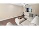Open-concept living room featuring hardwood floors and views into the kitchen at 102 Harvest Oaks Lane # 38, Durham, NC 27703