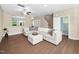 Bright living room featuring modern sofa, hardwood floors, and neutral paint at 102 Harvest Oaks Lane # 38, Durham, NC 27703