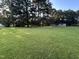 Spacious yard with large, mature trees around a cozy, single-story home at 10248 Nc-43, Rocky Mount, NC 27801