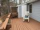 The back deck features a rocking chair and flower boxes for a relaxing outdoor space at 103 Cimmaron Ct, Cary, NC 27511