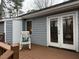 The back deck features a rocking chair and flower boxes for a relaxing outdoor space at 103 Cimmaron Ct, Cary, NC 27511