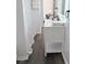 Bathroom features luxury vinyl flooring, modern fixtures, and a vanity with towel storage at 103 Cimmaron Ct, Cary, NC 27511