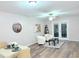 Cozy living room with modern furniture, stylish decor, and a view of the outdoors through French doors at 103 Cimmaron Ct, Cary, NC 27511