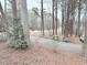 Scenic street view with lush trees and foliage leading to a charming home at 103 Cimmaron Ct, Cary, NC 27511