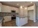Modern kitchen boasts stainless steel appliances, granite countertops, and a functional kitchen island for meal preparation at 108 Freedom Heights Ln # 147, Smithfield, NC 27577