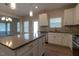 Spacious kitchen featuring a gray countertop island with stainless steel appliances, abundant natural light, and modern finishes at 108 Freedom Heights Ln # 147, Smithfield, NC 27577