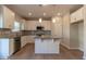 Well-equipped kitchen features white cabinets, stylish countertops, stainless steel appliances, and a convenient center island at 108 Freedom Heights Ln # 147, Smithfield, NC 27577
