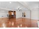 Finished basement featuring a bar, hardwood flooring and french doors perfect for entertainment and relaxation at 11124 Penderwood Ct, Raleigh, NC 27617