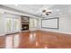 Spacious finished basement with a stone fireplace, ample lighting and a projection screen for entertainment at 11124 Penderwood Ct, Raleigh, NC 27617