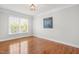 Bedroom featuring hardwood flooring, natural light and neutral paint is perfect for relaxation at 11124 Penderwood Ct, Raleigh, NC 27617