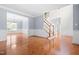 Bright foyer with hardwood flooring and an open floor plan creates a welcoming entrance at 11124 Penderwood Ct, Raleigh, NC 27617