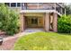Covered patio with brick pillars, offering a relaxing outdoor space and access to a backyard garden at 11124 Penderwood Ct, Raleigh, NC 27617