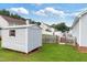 Exterior view of a backyard featuring green grass and storage sheds at 1113 Curtiss Dr, Garner, NC 27529