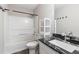 Bathroom featuring granite counter tops, vanity, shelving and shower and tub combo at 1113 Curtiss Dr, Garner, NC 27529