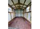 Interior view of the storage shed featuring wood flooring and storage shelving at 1113 Curtiss Dr, Garner, NC 27529