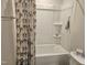 This bathroom has a toilet and a bath-shower combo with built-in shelving at 112 Wilbur Lake Dr, Fuquay Varina, NC 27526