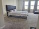 Spacious bedroom featuring plush carpeting, neutral walls, and natural light from large windows with curtains at 112 Wilbur Lake Dr, Fuquay Varina, NC 27526