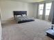 Large carpeted bedroom with big windows and curtains showing a comfortable interior space at 112 Wilbur Lake Dr, Fuquay Varina, NC 27526