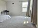 Empty carpeted bedroom with a window and curtain at 112 Wilbur Lake Dr, Fuquay Varina, NC 27526