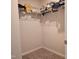 Walk-in closet with wire shelves and carpeted floor at 112 Wilbur Lake Dr, Fuquay Varina, NC 27526