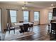 Dining area with marble table set, chandelier, and window views at 112 Wilbur Lake Dr, Fuquay Varina, NC 27526