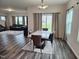 Open-concept dining room with modern table set and views to the backyard at 112 Wilbur Lake Dr, Fuquay Varina, NC 27526