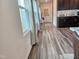 Entry hall showcases pristine floors that lead to the kitchen area at 112 Wilbur Lake Dr, Fuquay Varina, NC 27526