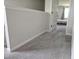 Upstairs hallway with carpeting and view into adjacent bedroom at 112 Wilbur Lake Dr, Fuquay Varina, NC 27526